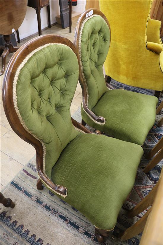 A pair of Victorian mahogany green buttonback nursing chairs